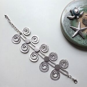 Elegant Silver Swirl Bracelet